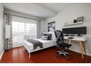 Bedroom with wood finished floors and baseboards
