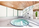 View of swimming pool featuring an indoor in ground hot tub