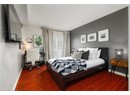 Bedroom with baseboards and wood finished floors