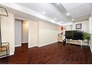 Living room with recessed lighting, visible vents, baseboards, and wood finished floors