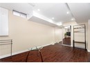 Finished below grade area with recessed lighting, baseboards, and wood finished floors