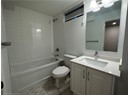 Full bathroom featuring  shower combination, toilet, marble finish floor, and vanity