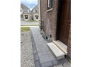 Exterior details with a residential view, brick siding, and gas meter