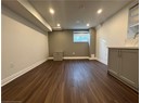 Below grade area featuring dark wood-type flooring, baseboards, and recessed lighting
