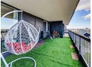 View of green lawn with a balcony