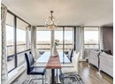 Dining area featuring a chandelier and wood finished floors