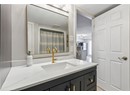 Full bath featuring vanity