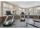Exercise room featuring ornamental molding, plenty of natural light, and recessed lighting
