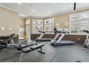 Exercise room with crown molding, recessed lighting, and baseboards