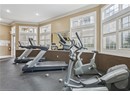 Exercise room with ornamental molding, recessed lighting, and baseboards