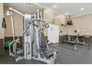 Workout area with crown molding and recessed lighting