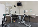 Exercise room featuring crown molding