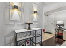 Foyer entrance with wood finished floors and baseboards