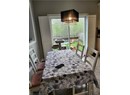 Dining area featuring a chandelier and light tile patterned flooring
