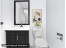 Half bath featuring vanity and toilet