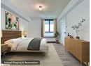 Bedroom with wood finished floors and a textured ceiling