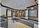Lobby with crown molding and recessed lighting