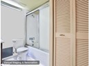 Bathroom with a closet, toilet, enclosed tub / shower combo, and vanity