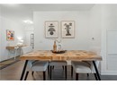 Dining room with wood finished floors and baseboards
