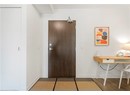 Entrance foyer featuring baseboards and wood finished floors