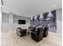 Cinema featuring wood finished floors, baseboards, bowling, and recessed lighting