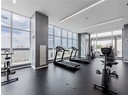 Exercise room featuring a wall of windows