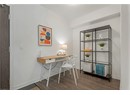 Office space with baseboards and wood finished floors