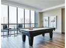 Game room featuring a city view, wood finished floors, a wall of windows, billiards table, and recessed lighting