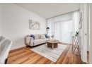 Living room with baseboards and wood finished floors