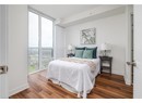 Bedroom with wood finished floors and baseboards