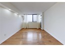 Empty room with light wood finished floors, recessed lighting, and baseboards