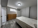 Bedroom featuring dark wood-style floors