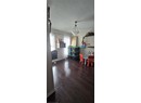 Dining area featuring a textured ceiling and wood finished floors