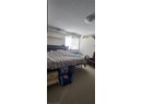 Bedroom featuring carpet and a textured ceiling