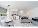 Living area featuring light tile patterned floors