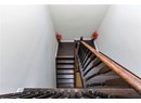 Stairs featuring wood finished floors and baseboards