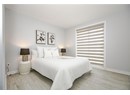 Bedroom featuring baseboards and light wood-style flooring