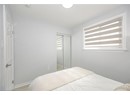 Bedroom featuring baseboards and a closet
