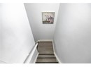 Stairs featuring baseboards and wood finished floors