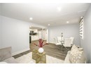 Dining room with baseboards, wood finished floors, and recessed lighting