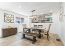Dining space with wood finished floors, baseboards, recessed lighting, and a textured ceiling