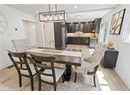 Dining space featuring light wood finished floors, baseboards, and recessed lighting
