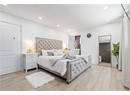Bedroom with light wood finished floors and recessed lighting