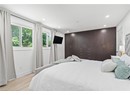 Bedroom featuring light wood-type flooring, recessed lighting, and baseboards