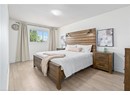 Bedroom with light wood-style flooring and baseboards