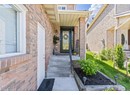 Entrance to property featuring brick siding