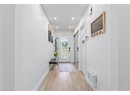 Entryway featuring light wood finished floors, recessed lighting, and baseboards