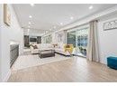 Living area featuring recessed lighting, wood finished floors, and baseboards