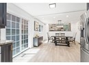 Dining space with baseboards, light wood-type flooring, recessed lighting, and healthy amount of natural light