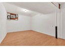 Unfurnished room featuring light wood finished floors and baseboards